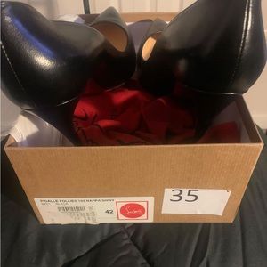 Black Louboutin Heels.